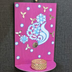 Pink T-light holder on wall hanging